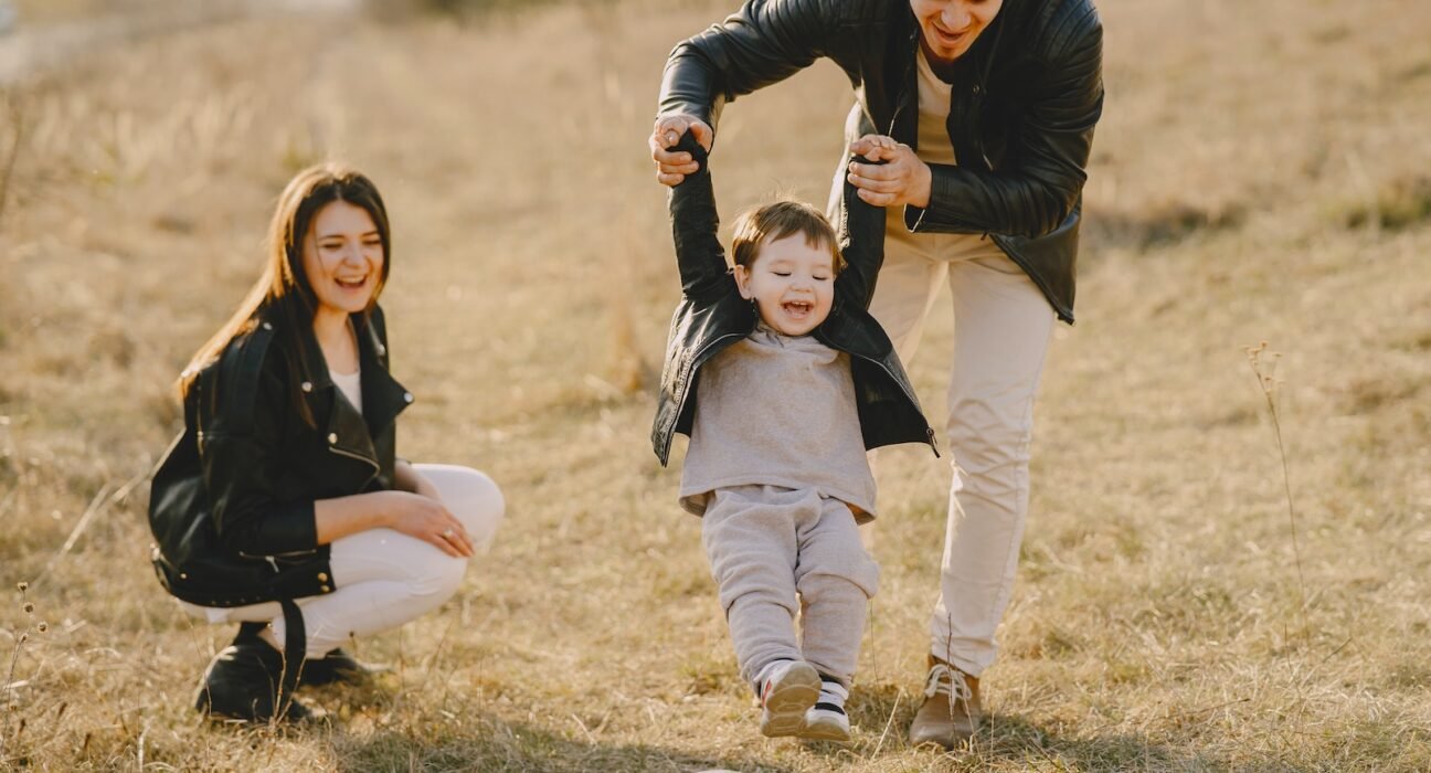 Photo of Family Having Fun With Soccer Ball