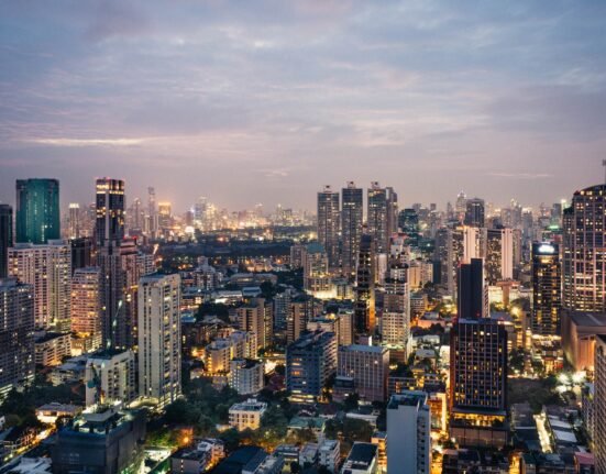 aerial photography of high-rise buildings under cloudy sky