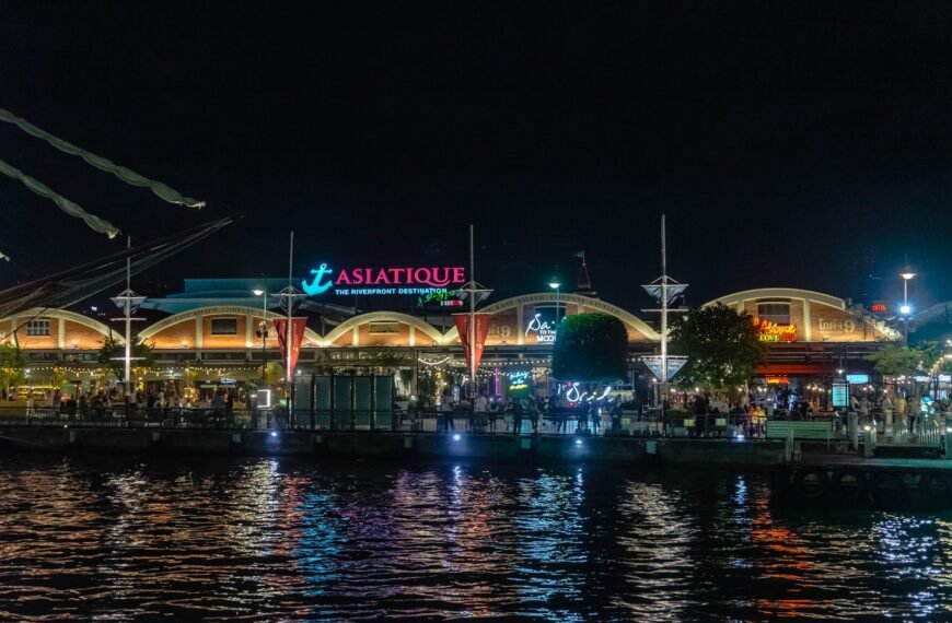 a night view of a restaurant on the water
