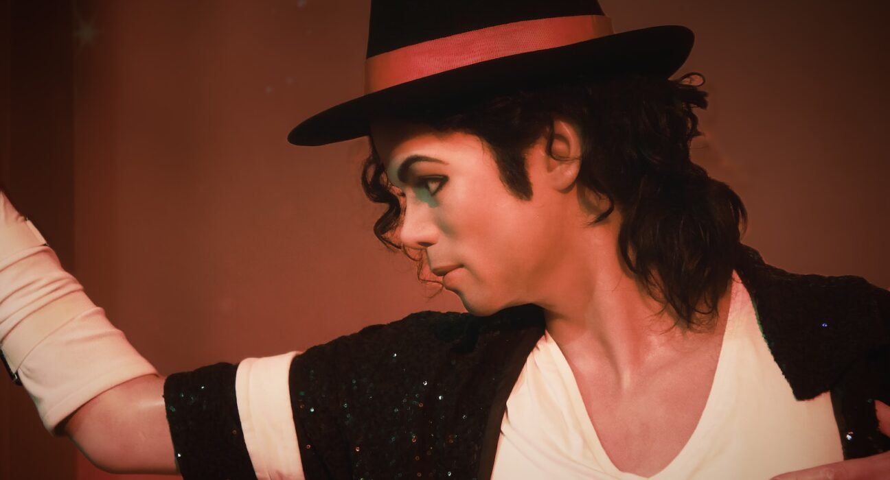 a man in a top hat and black jacket