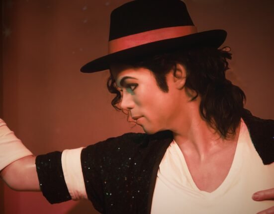 a man in a top hat and black jacket