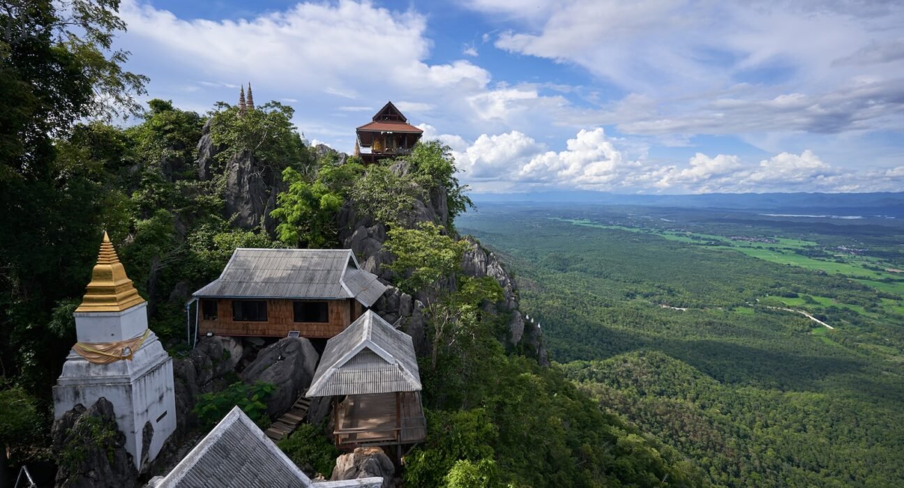 a view of a mountain top with a tower in the middle