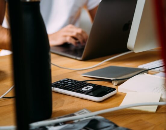 person using silver MacBook