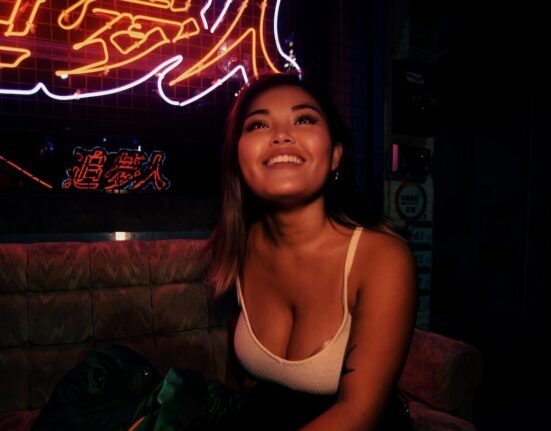 a woman sitting on a couch