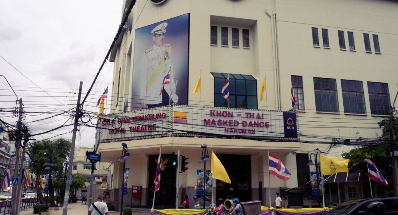 a building with flags on the roof