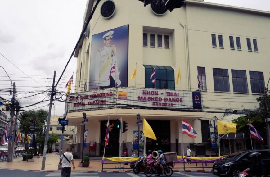 a building with flags on the roof