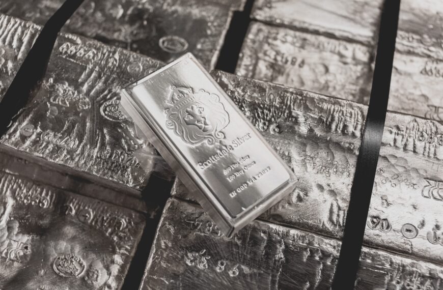 a scottsdale mint stacker bar sits on top of a pallet of raw silver.