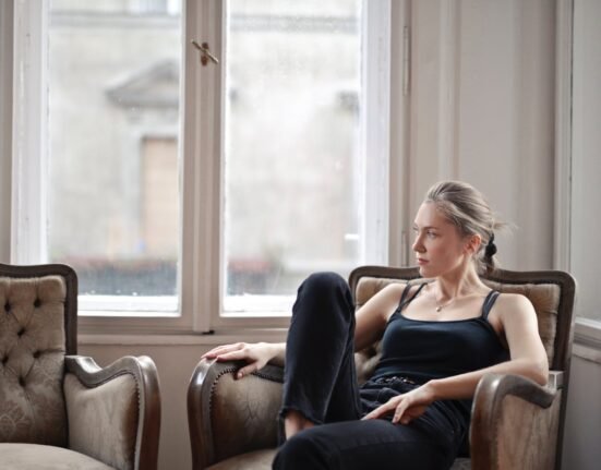 Woman Sitting on Chair