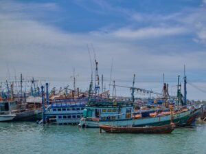 blue and brown boat on water during daytime
