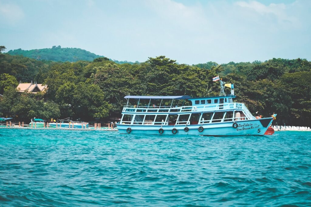 white boat on body of water during daytime