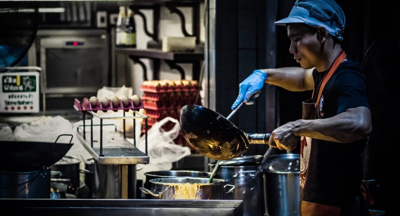 man cooking in kitchen