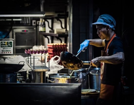 man cooking in kitchen