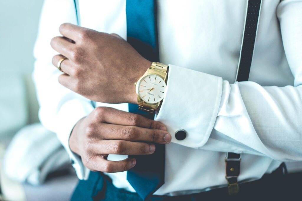 white shirt and gold watch