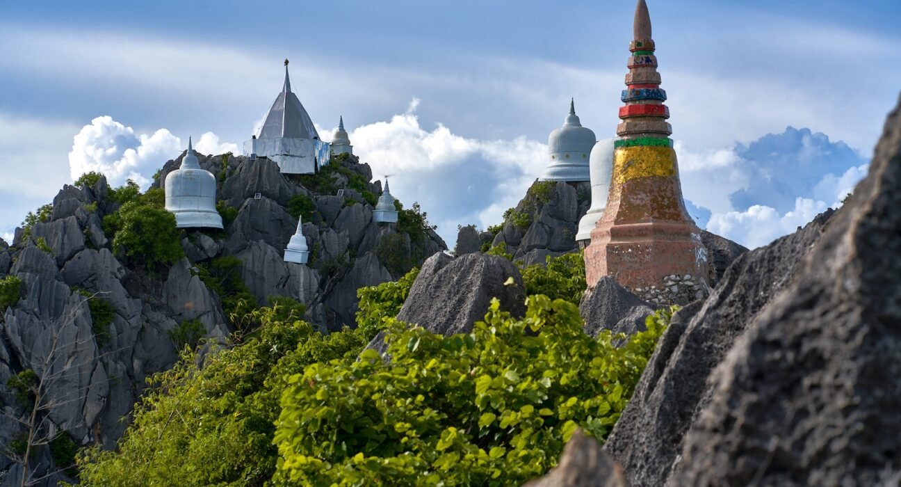 a building with a mountain in the background
