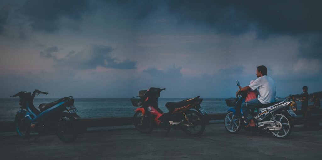 black and red motorcycle on beach during daytime