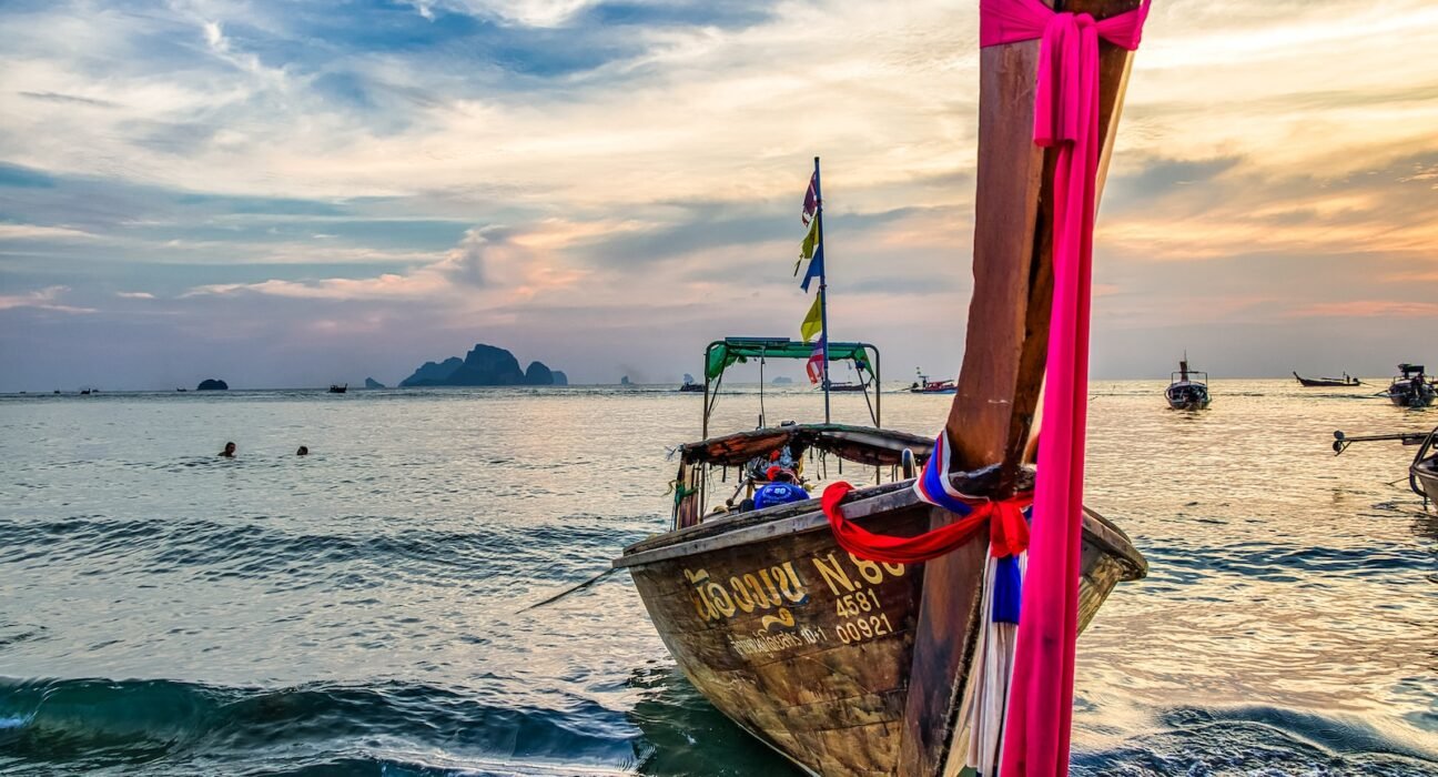 brown boat on sea during daytime