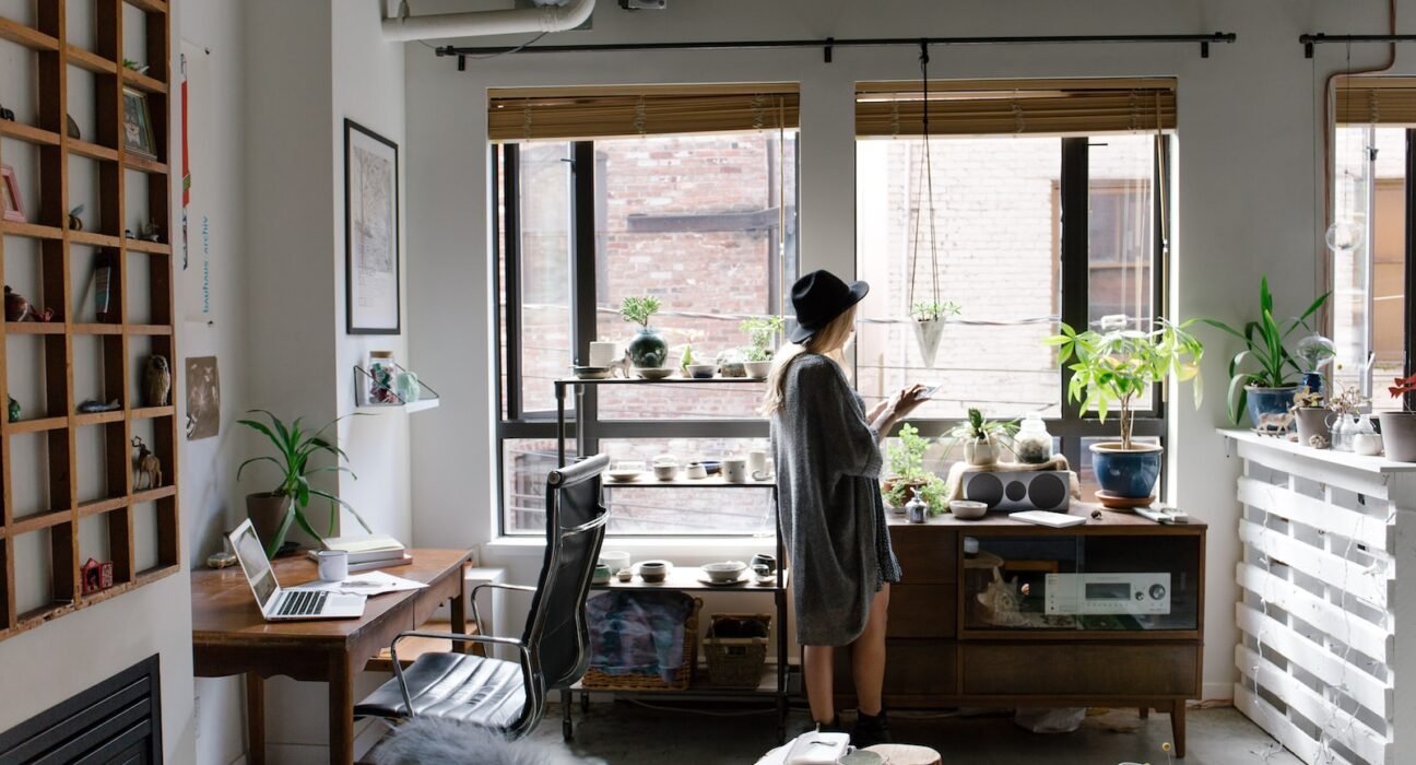 woman standing near brown wooden cabinet