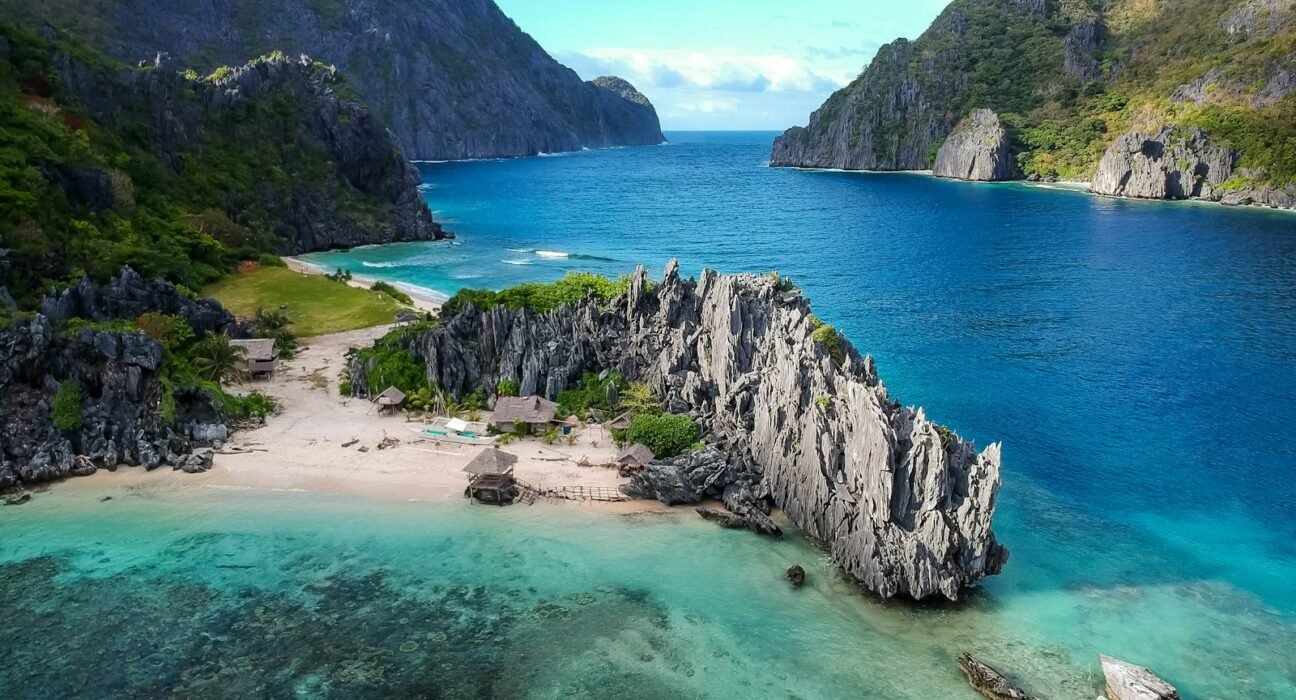 aerial photo of body of water between mountains