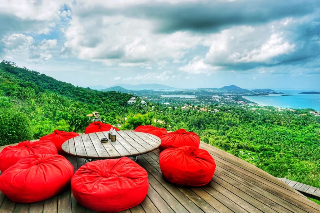 red and white kayak on brown wooden dock
