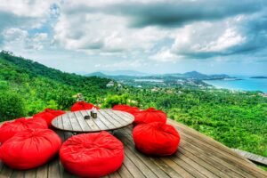 red and white kayak on brown wooden dock