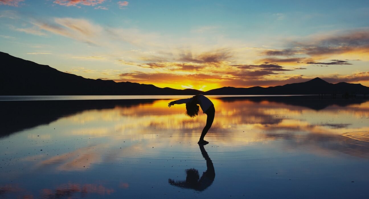 silhouette photography of woman doing yoga