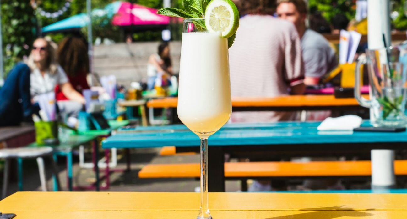 selective focus photography of wine glass on table