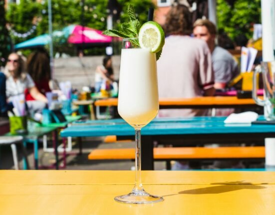 selective focus photography of wine glass on table