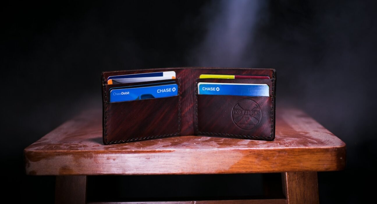 brown leather bifold wallet on table