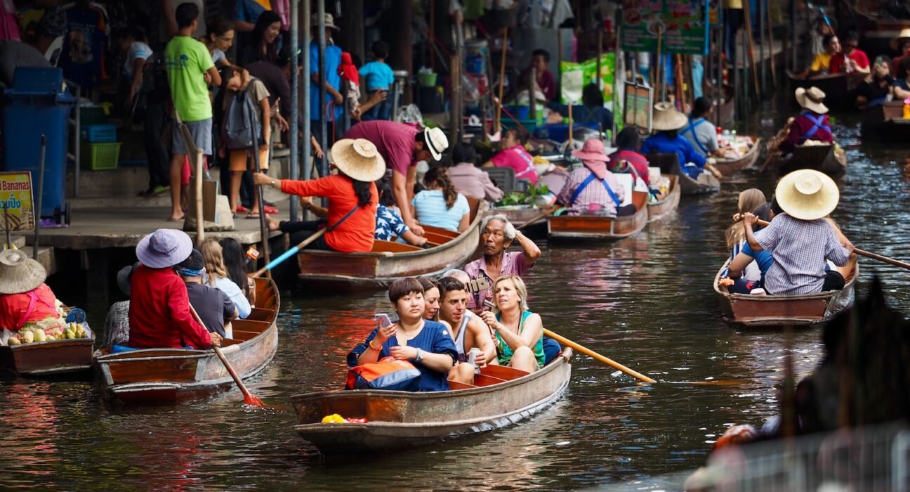 people riding on boat on river during daytime