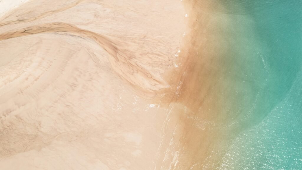 the curve of sand and sea
