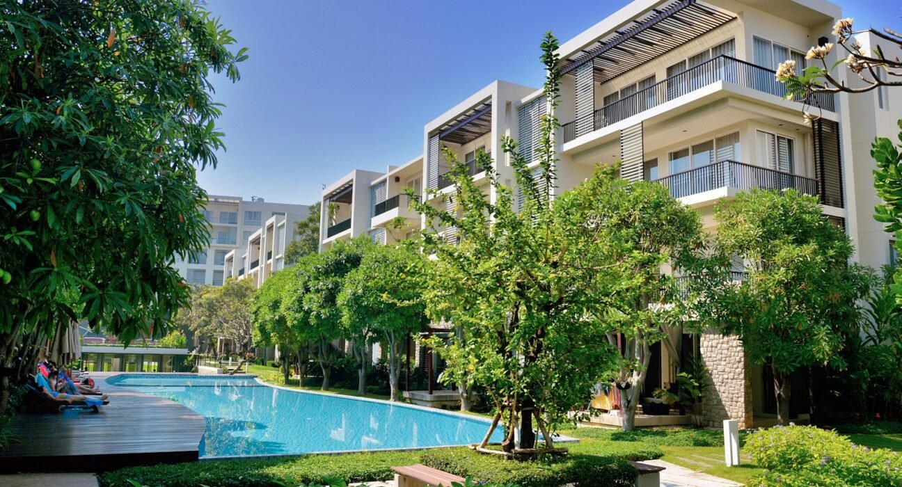 green trees near swimming pool during daytime