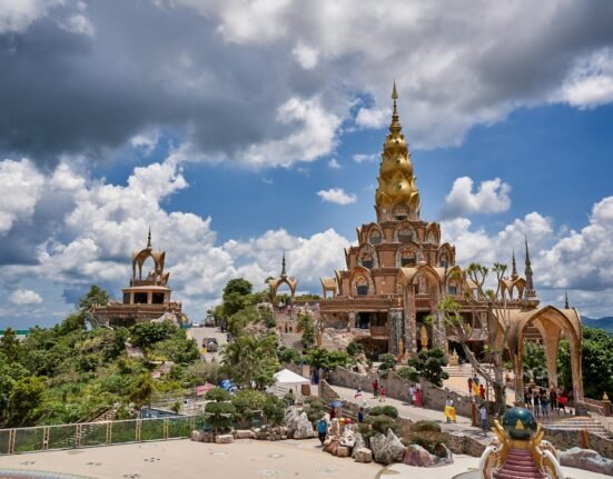 a large building with a golden spire on top of it