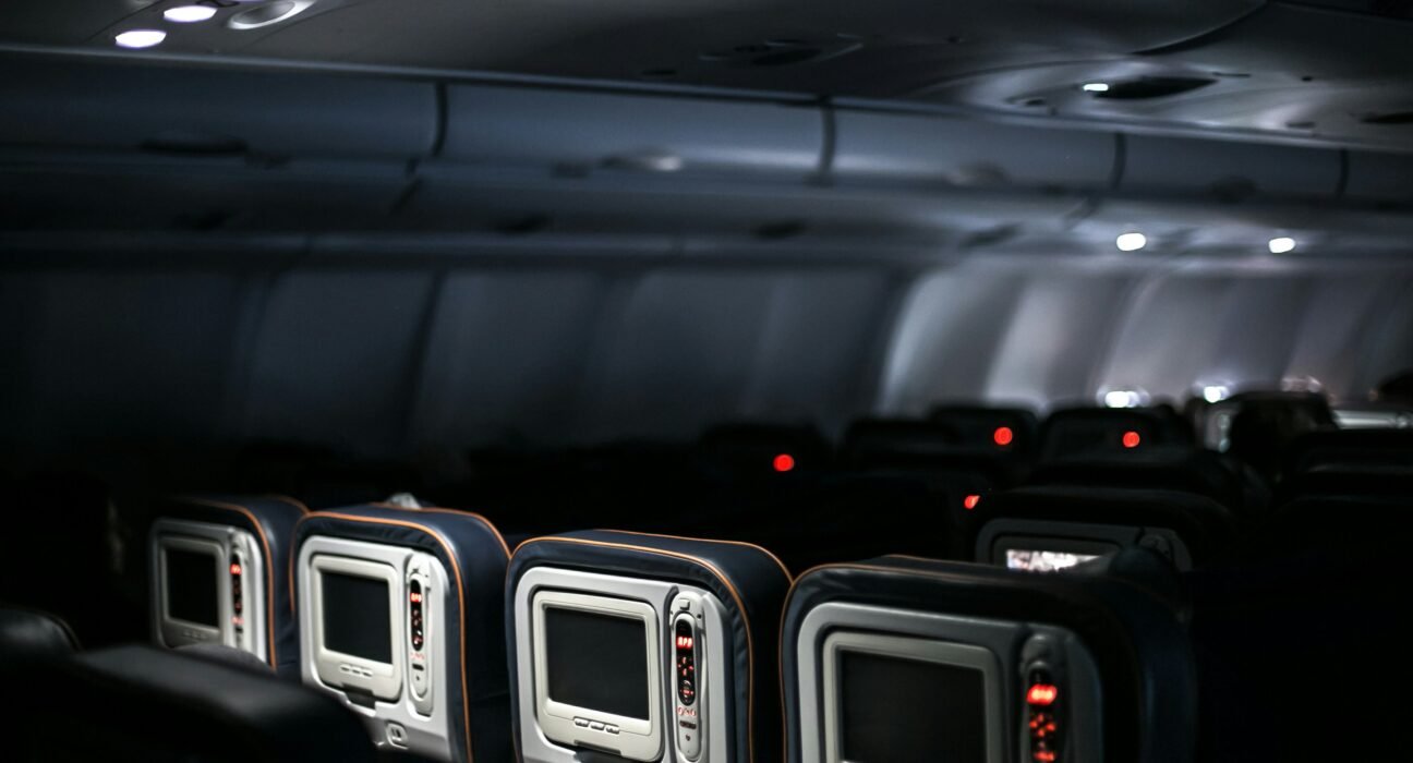 a plane's interior, with empty seats