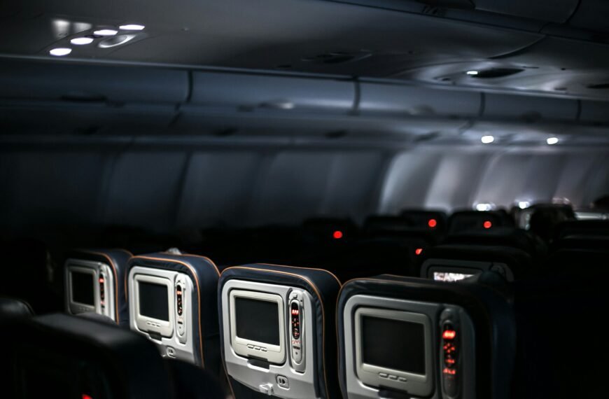 a plane's interior, with empty seats