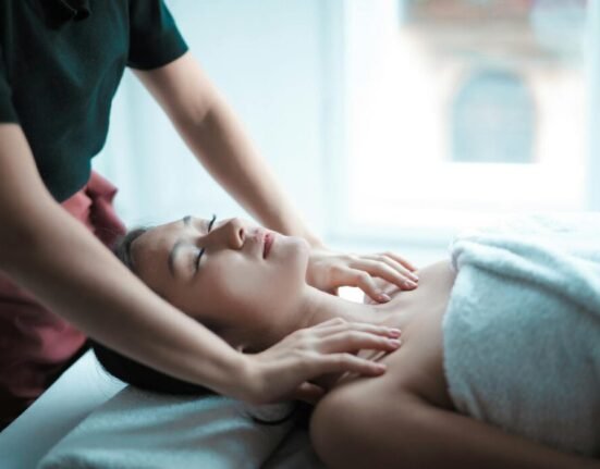 Selective Focus Photo of Woman Getting a Massage