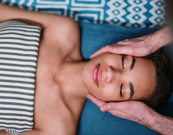 Man Lying on Blue and White Textile