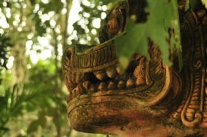 brown wooden human face carved ornament