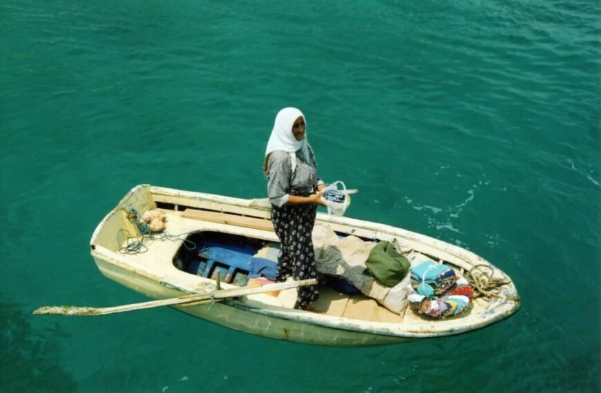 woman standing on middle of boat