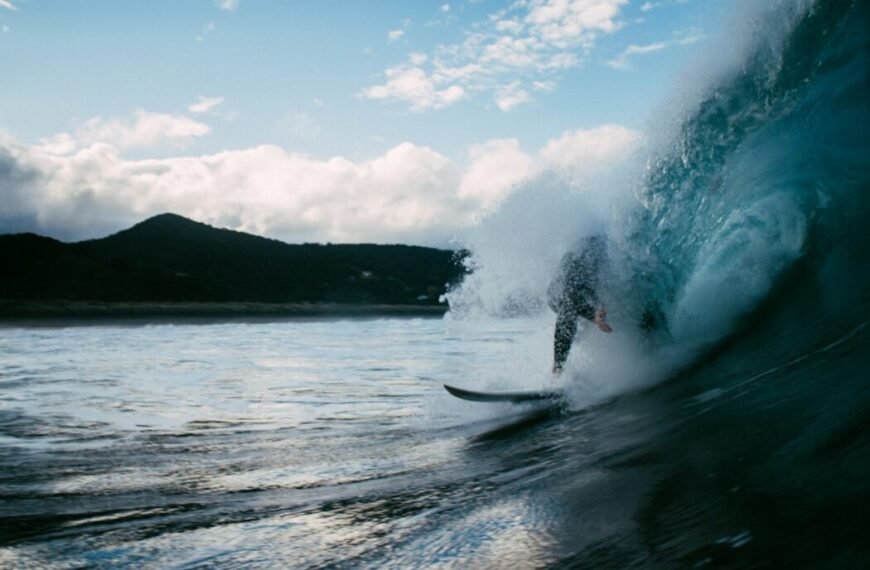 surfer surfing on tidal wave